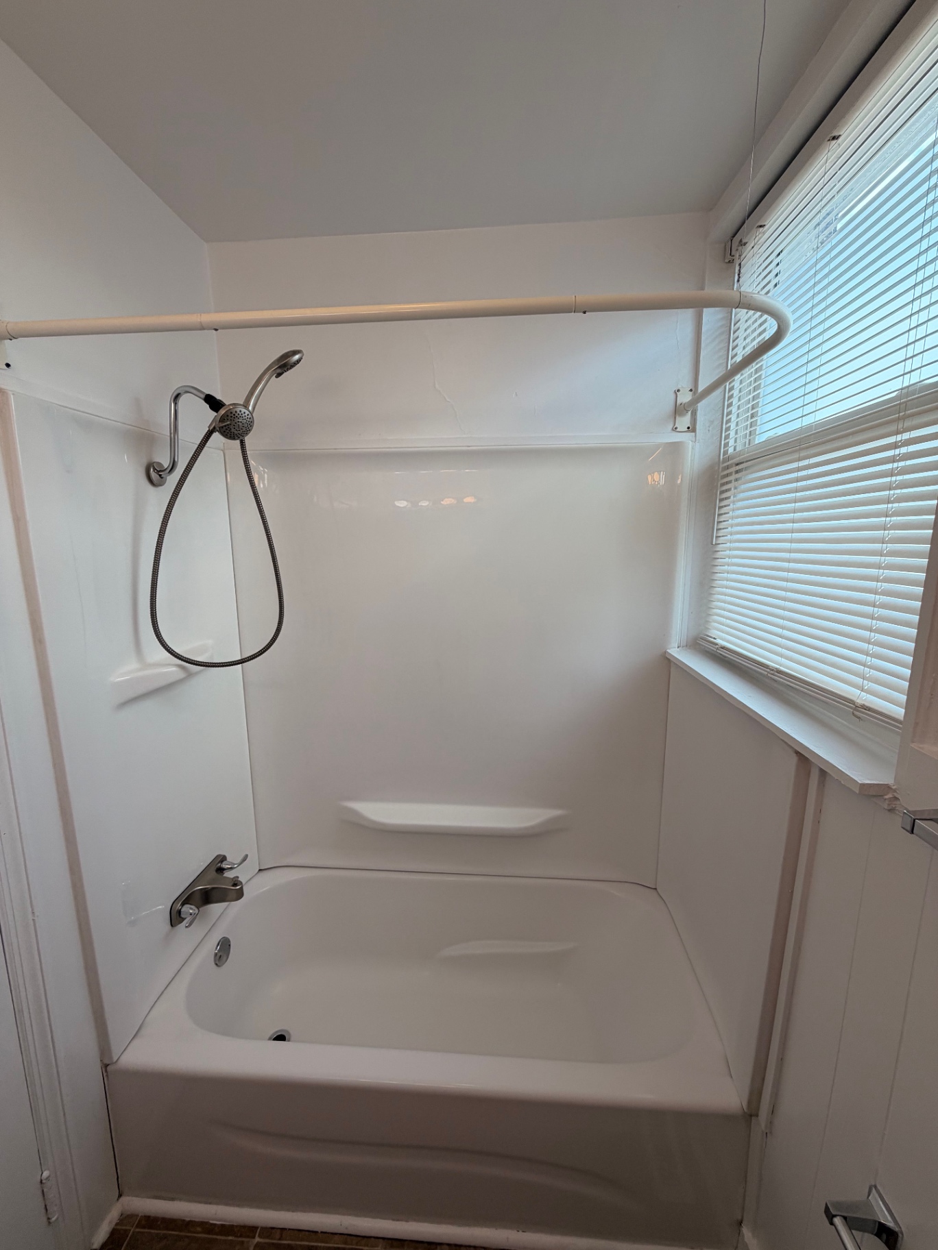 3340 Chestnut Upstairs updated tub and shower surround with handheld showerhead