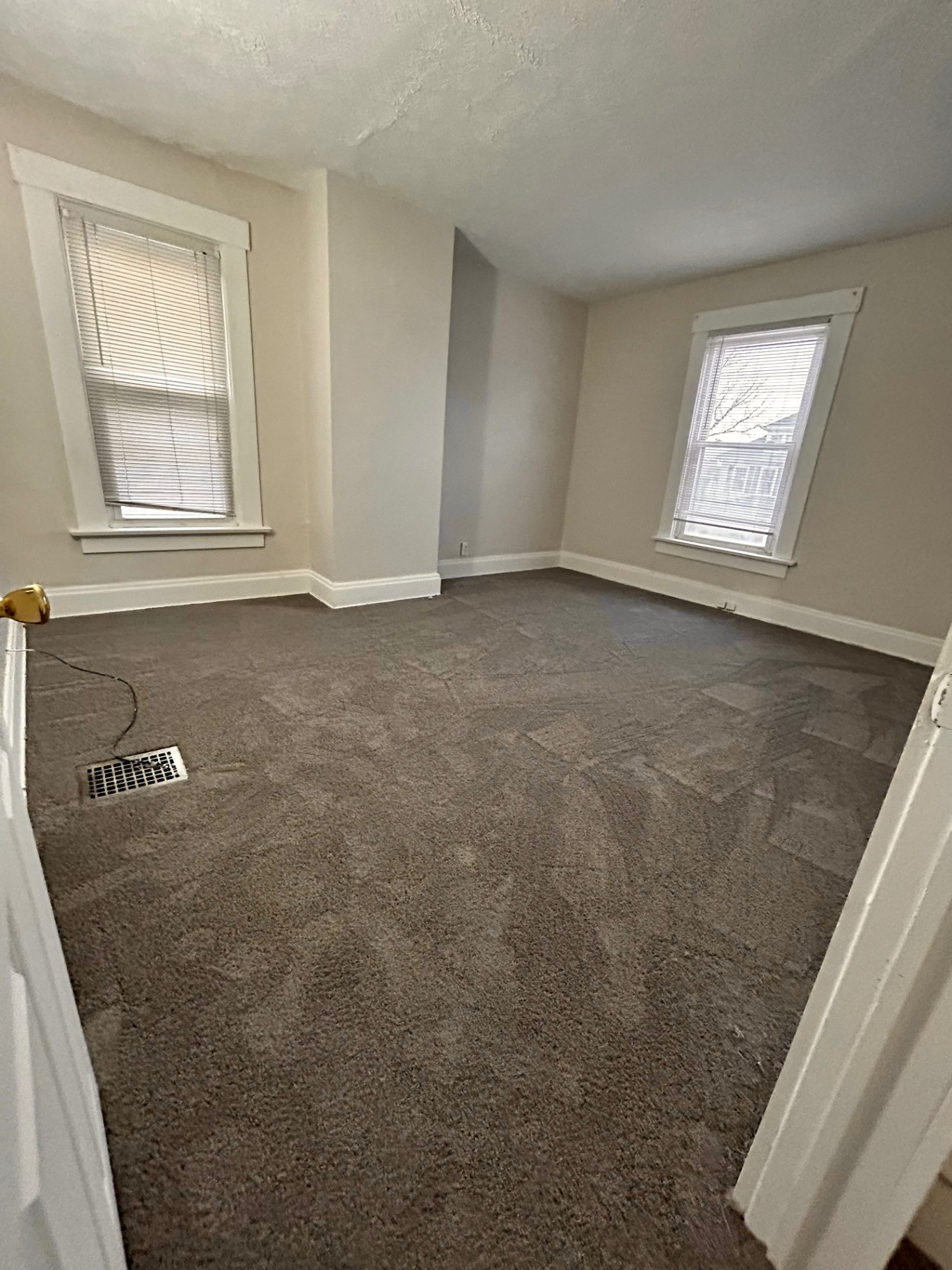 68 E Patterson Ave. corner bedroom with two windows and plush carpet