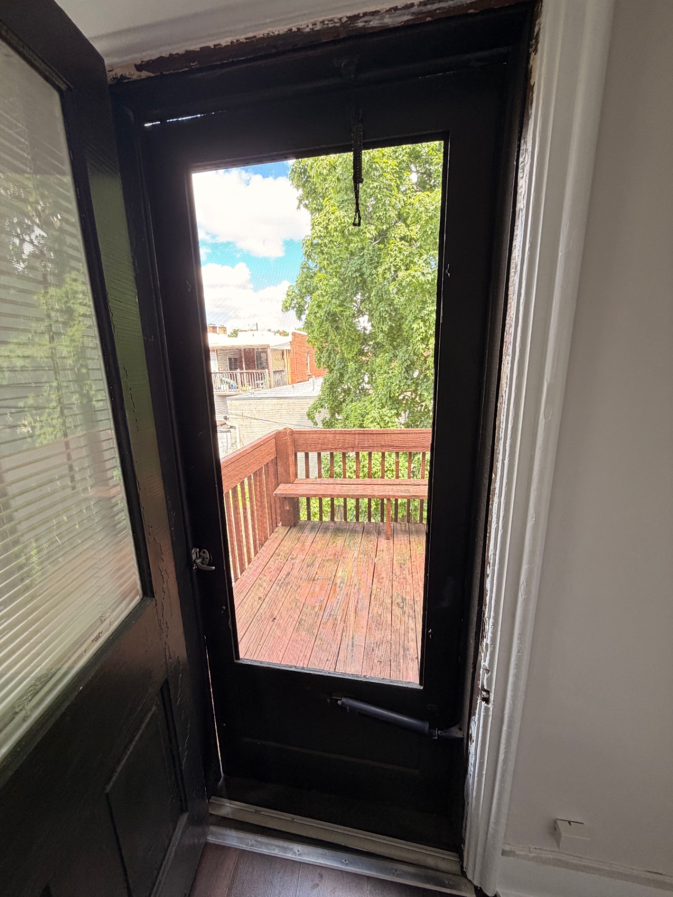 3340 Chestnut Upstairs back door with view onto the private wood deck