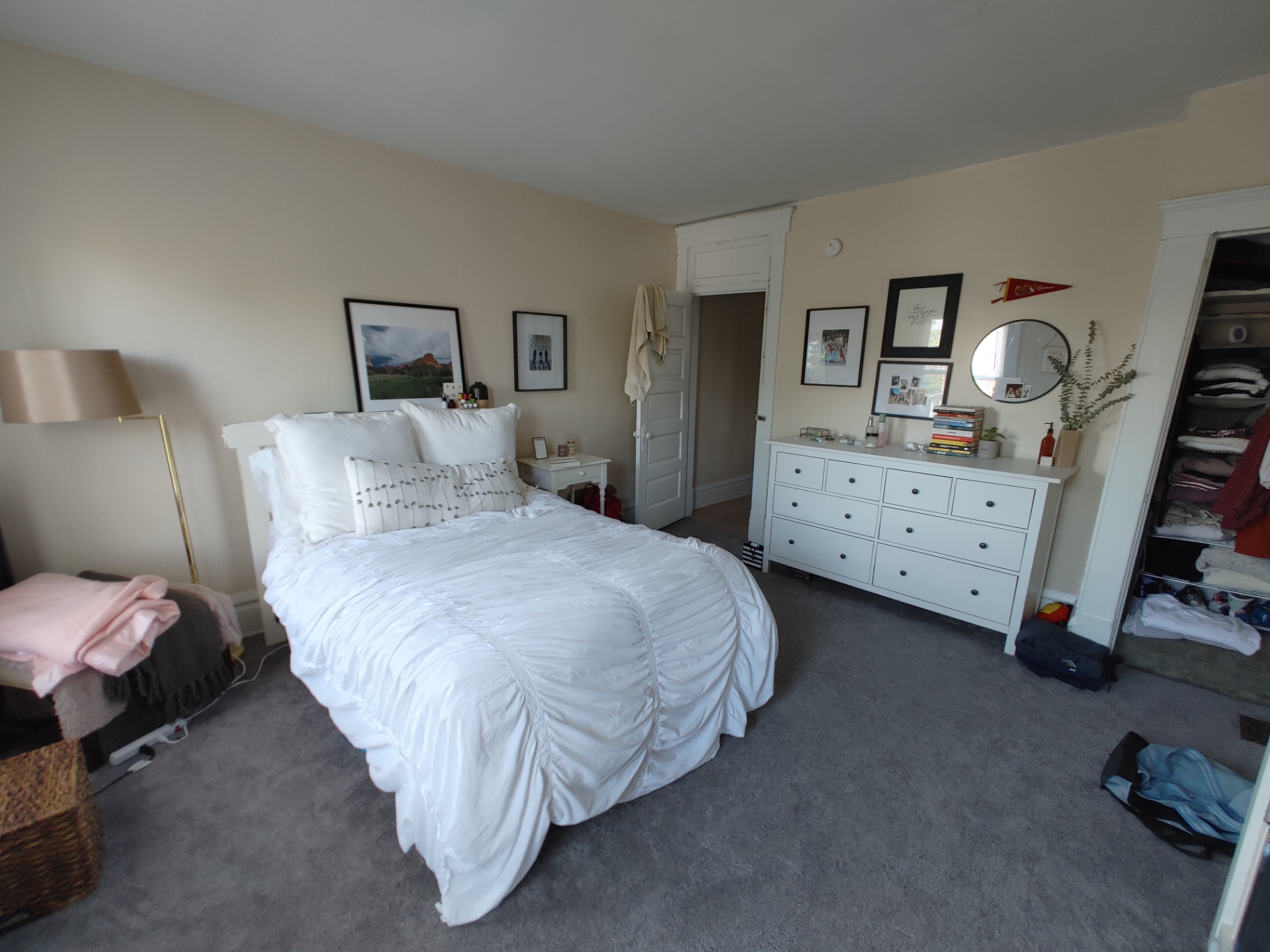 117 W 9th primary bedroom with plush carpet, dresser and closet