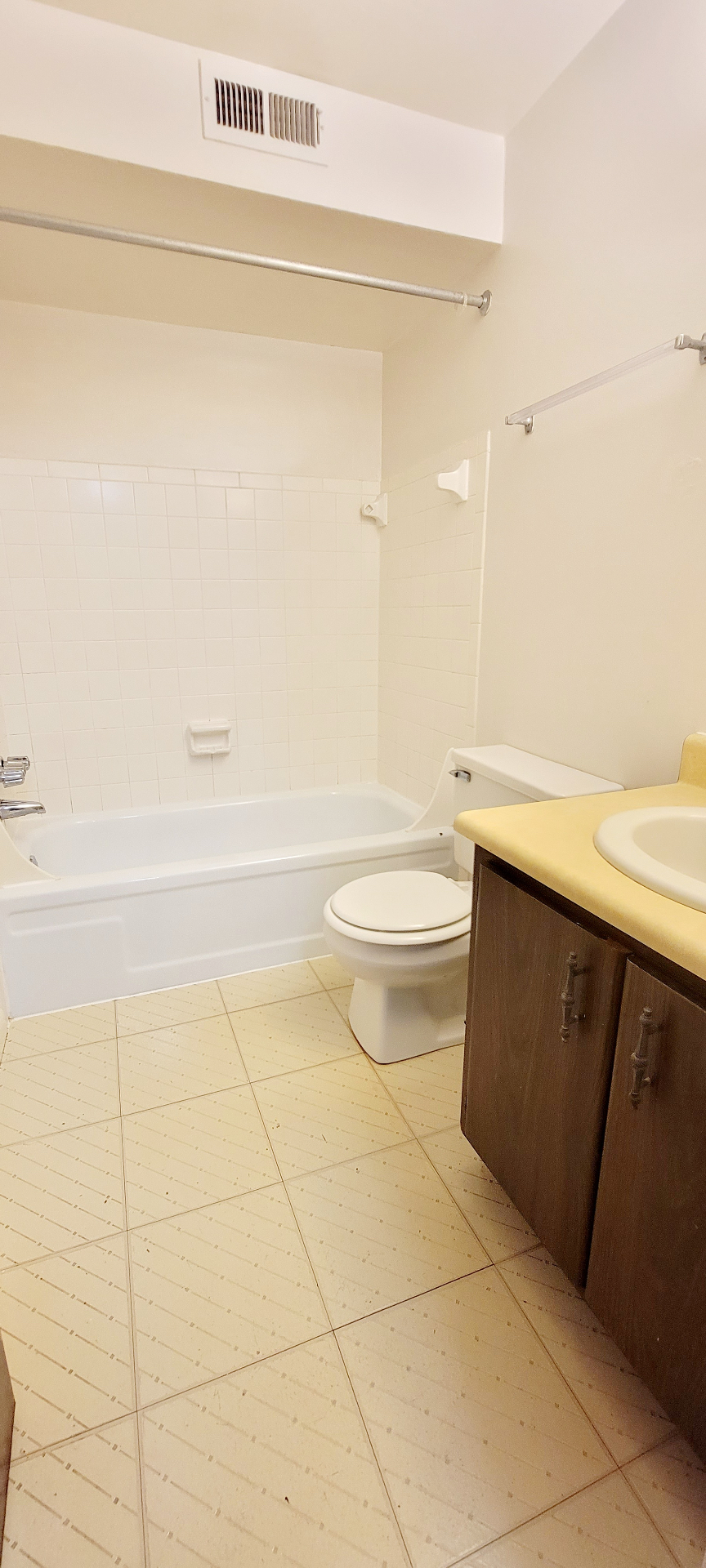 2022 Summit St. full bathroom with tub-shower, wood vanity, and tile floor