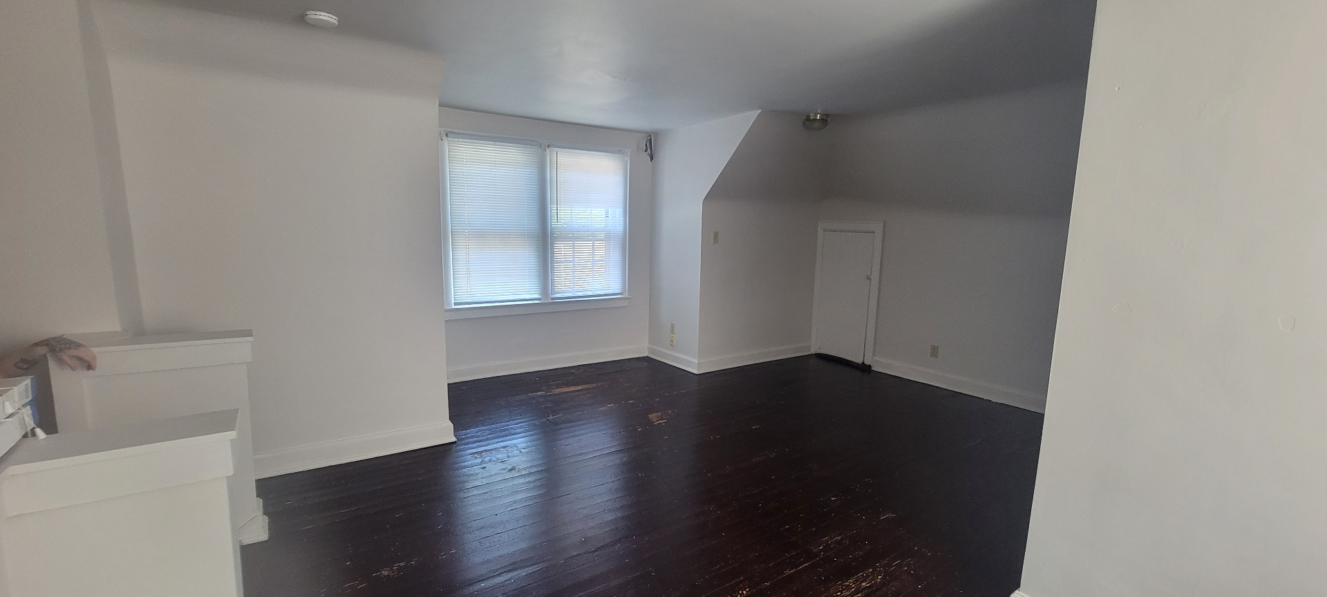 2044 Iuka Ave. C bright upper-level bonus room with two tall windows and open floor area