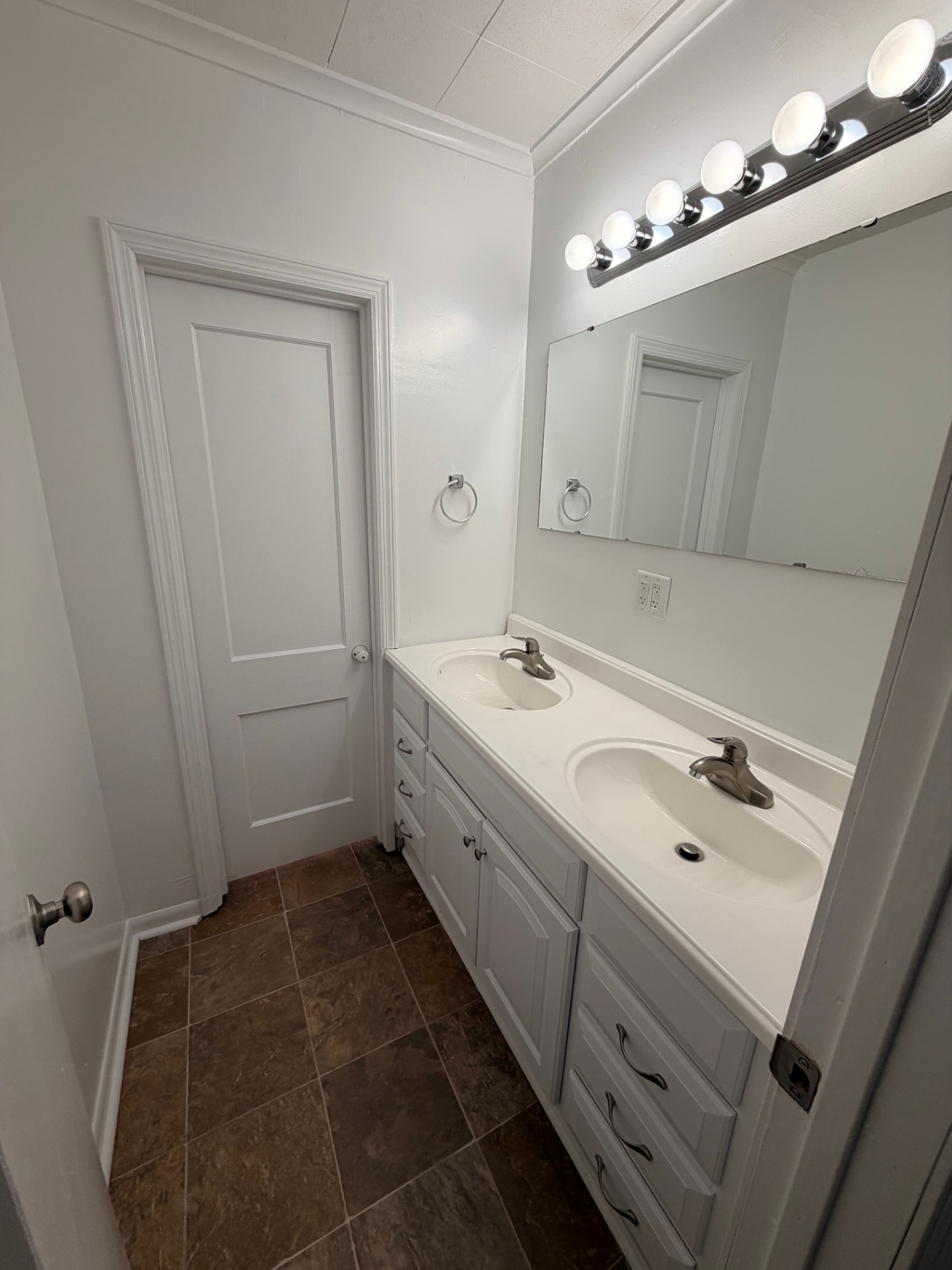 3340 Chestnut Upstairs bathroom with double vanity, large mirror and vanity lighting