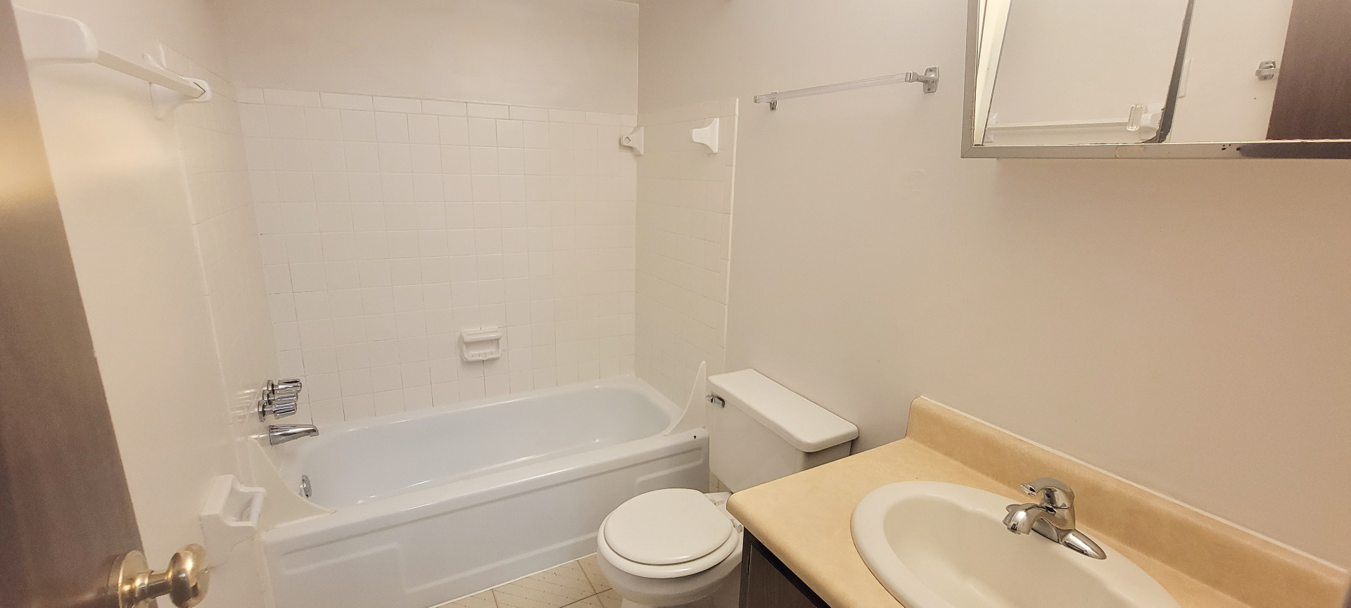 2024 Summit St. full bathroom with tub shower, vanity, and tile flooring