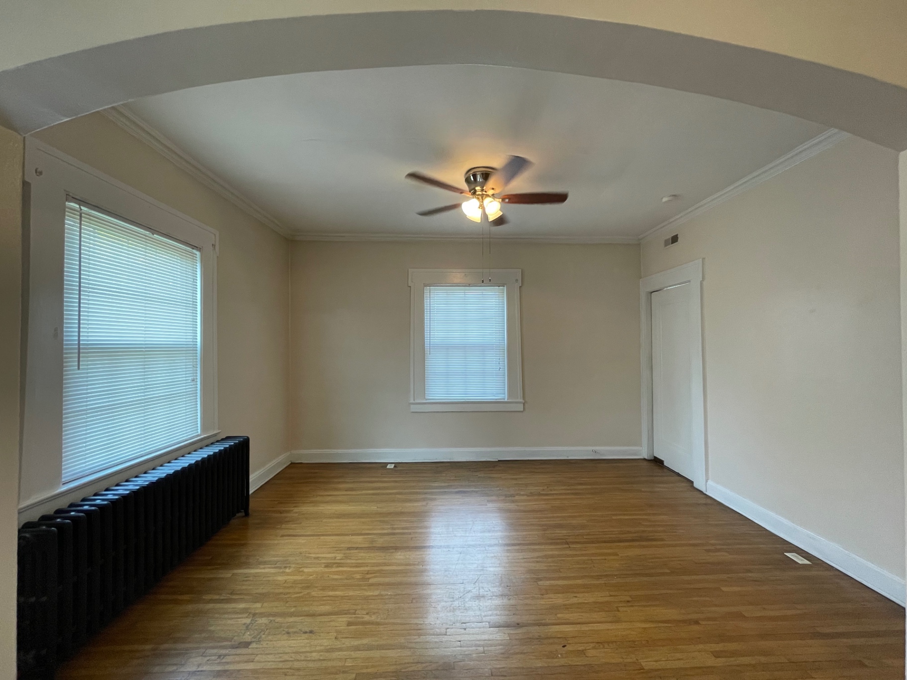 Unit E dining area with arched entryway