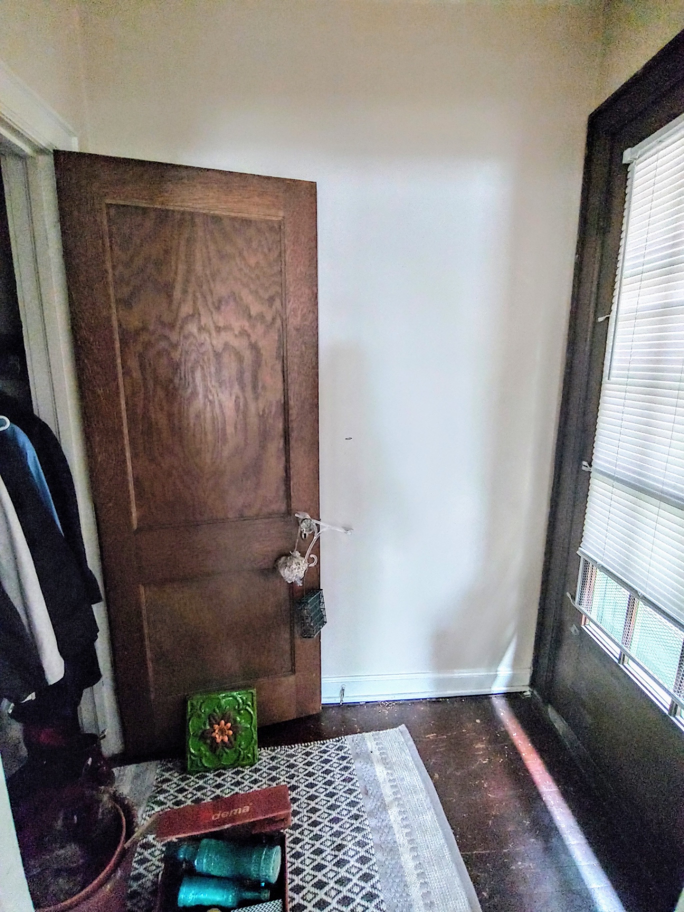 2044 Iuka Ave. B private entry door with original wood detailing and hardwood floors
