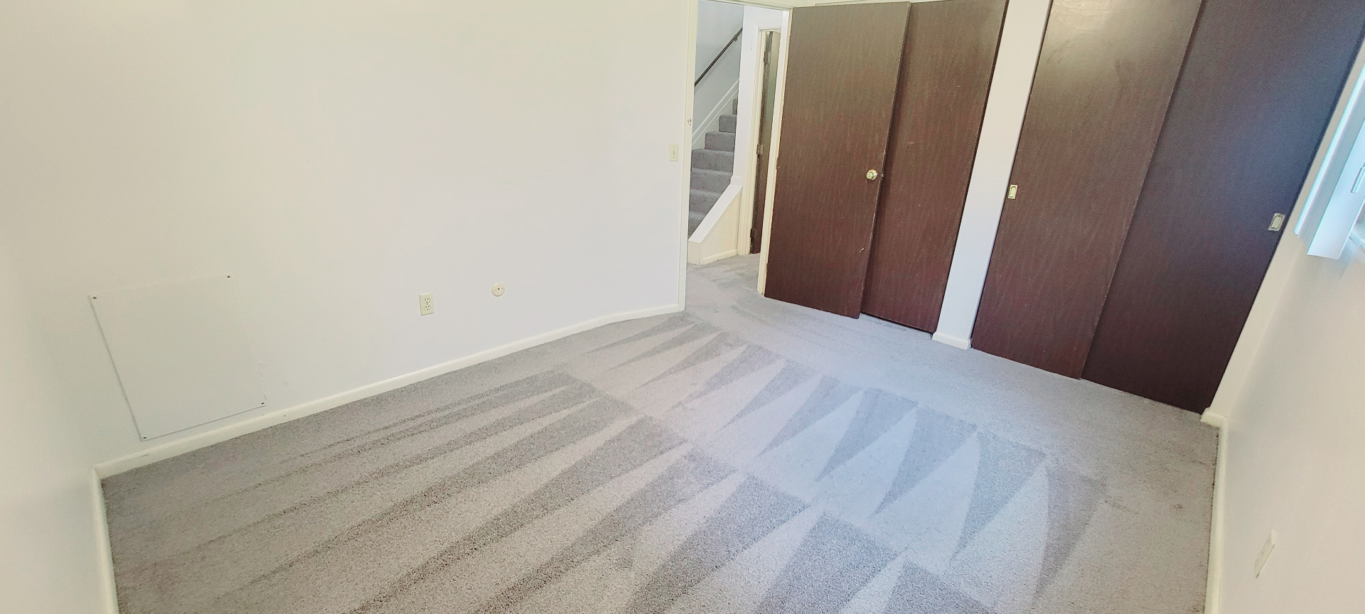 2022 Summit St. second bedroom with double closets and fresh grey carpet