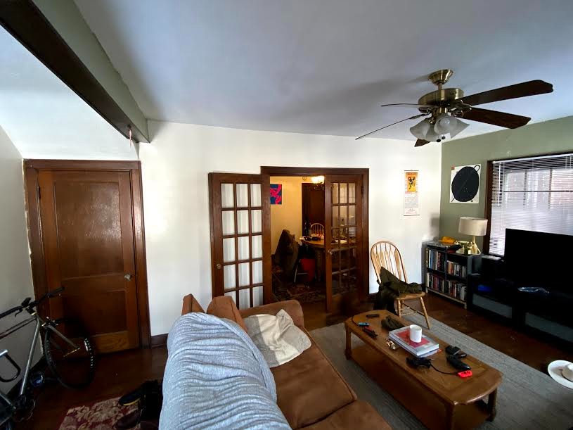2054 Iuka Ave. B living room with French doors opening to dining area and ceiling fan