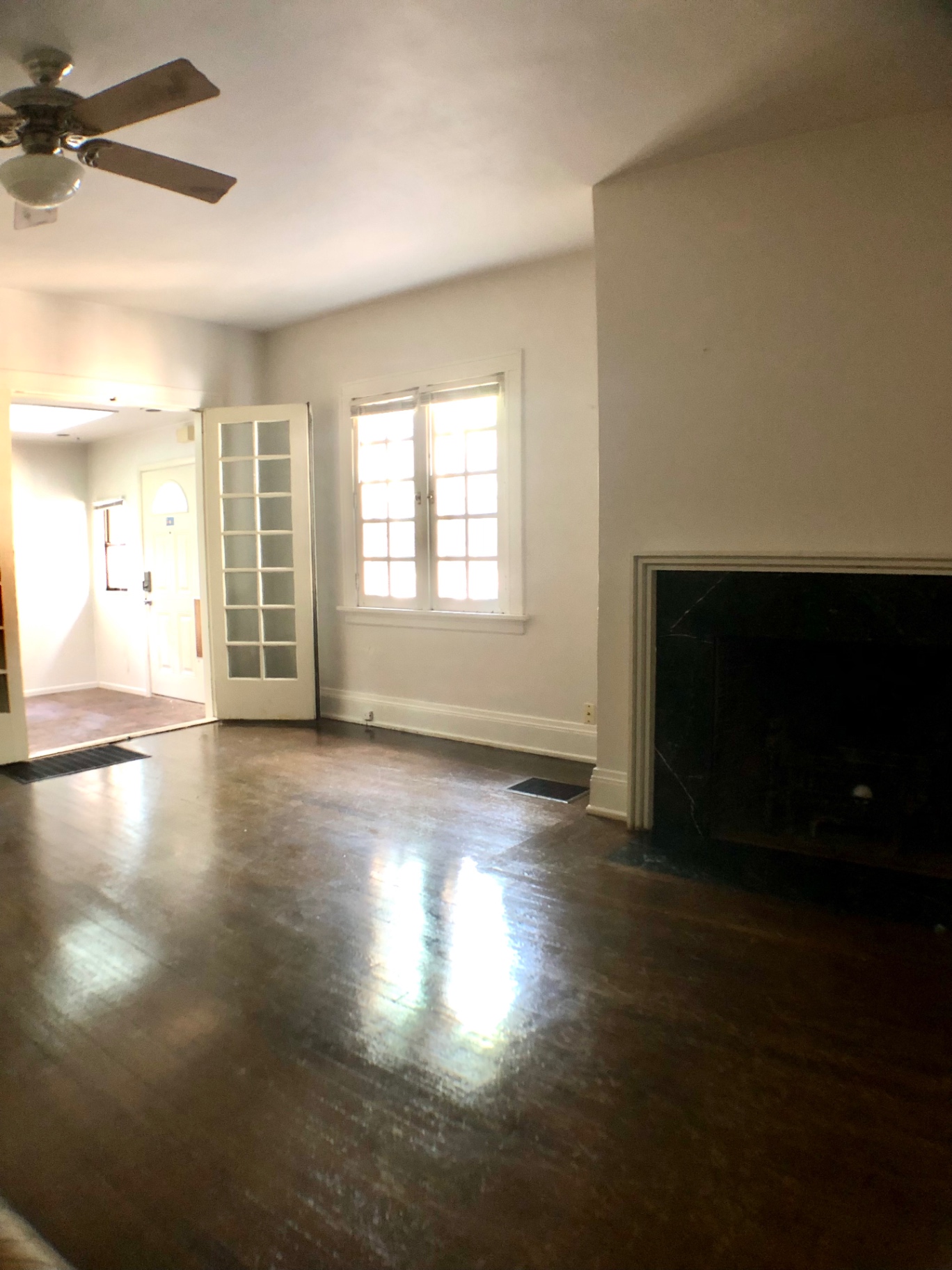 2026 Iuka Ave A living room with fireplace and French doors to the entry