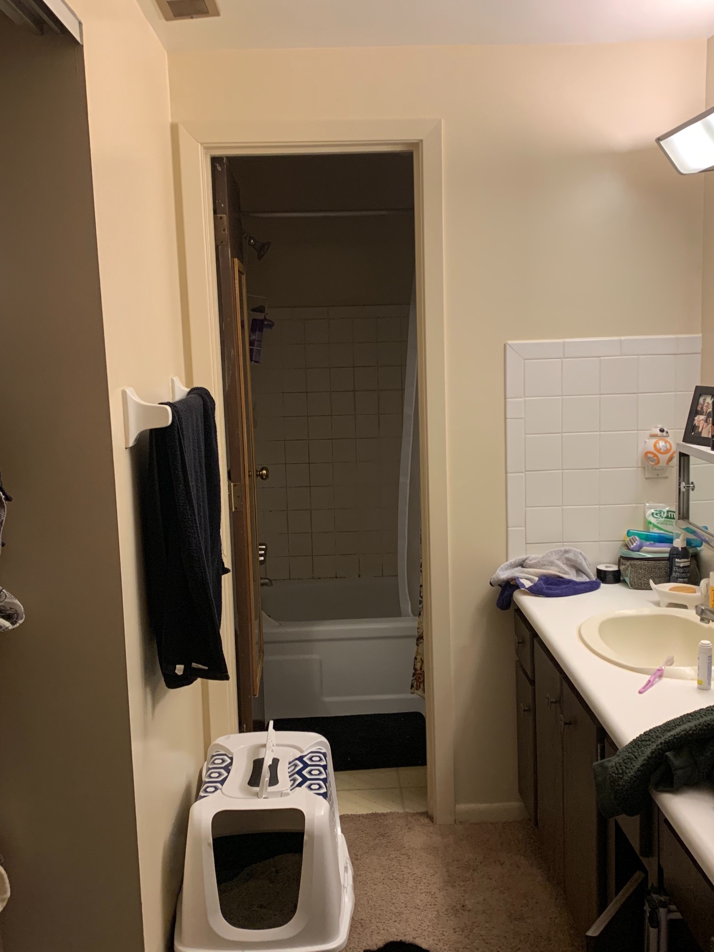 2030 Summit St Unit 1 bathroom with vanity, tub/shower, and linen closet