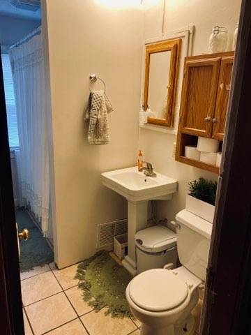 2155 N 4th St. bathroom with pedestal sink, medicine cabinet, and tile floor