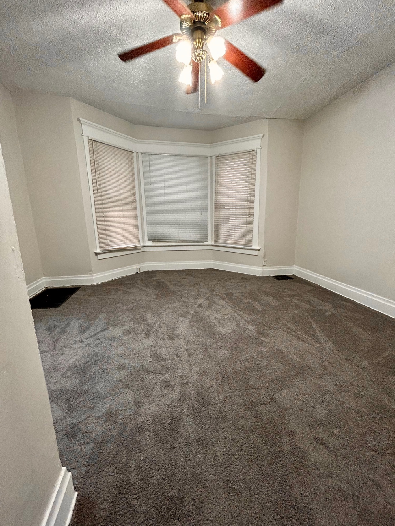 68 E Patterson Ave. bedroom with bay window and ceiling fan