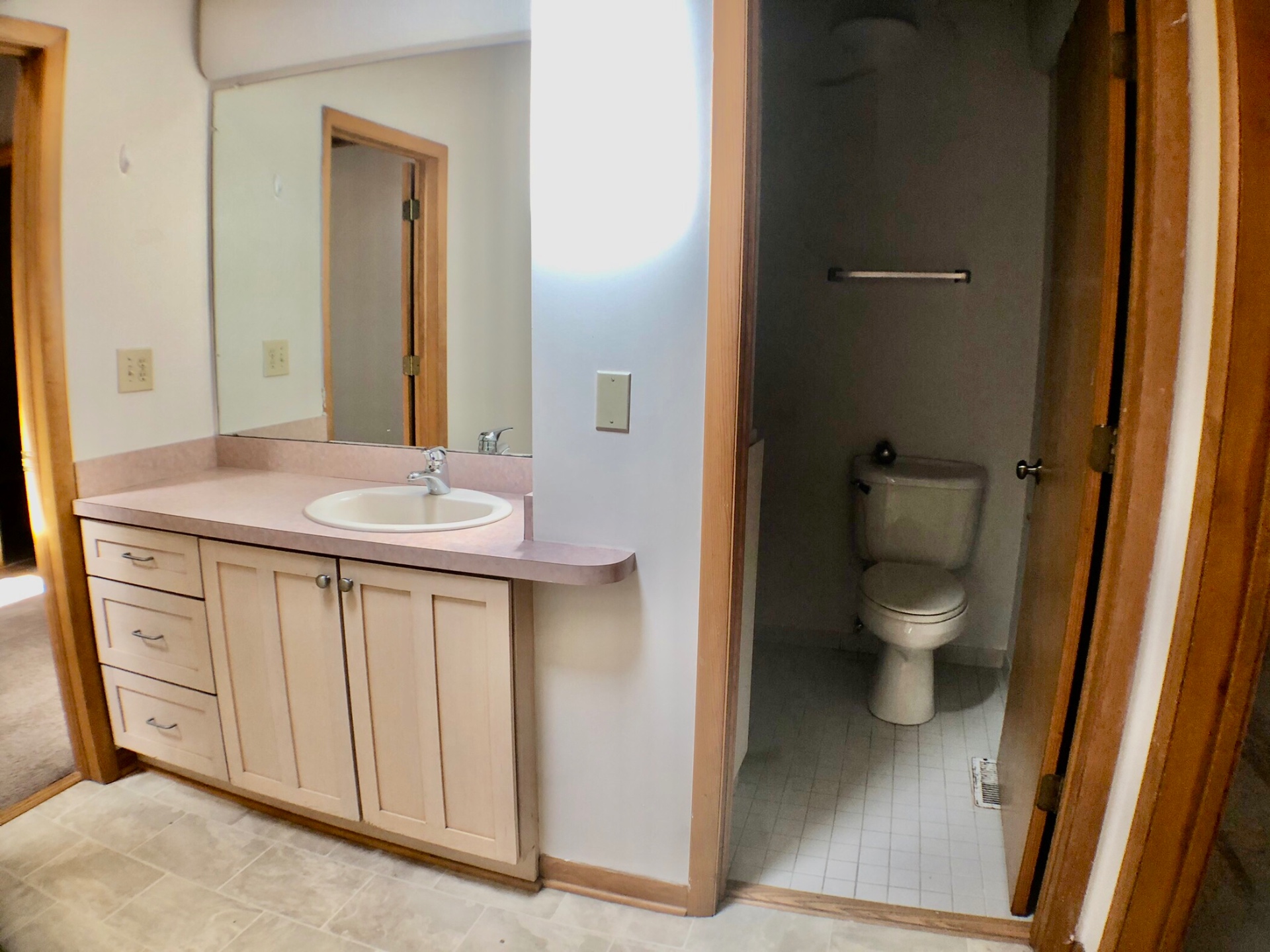 2040 Iuka Ave House bathroom with vanity, mirror, and separate toilet room