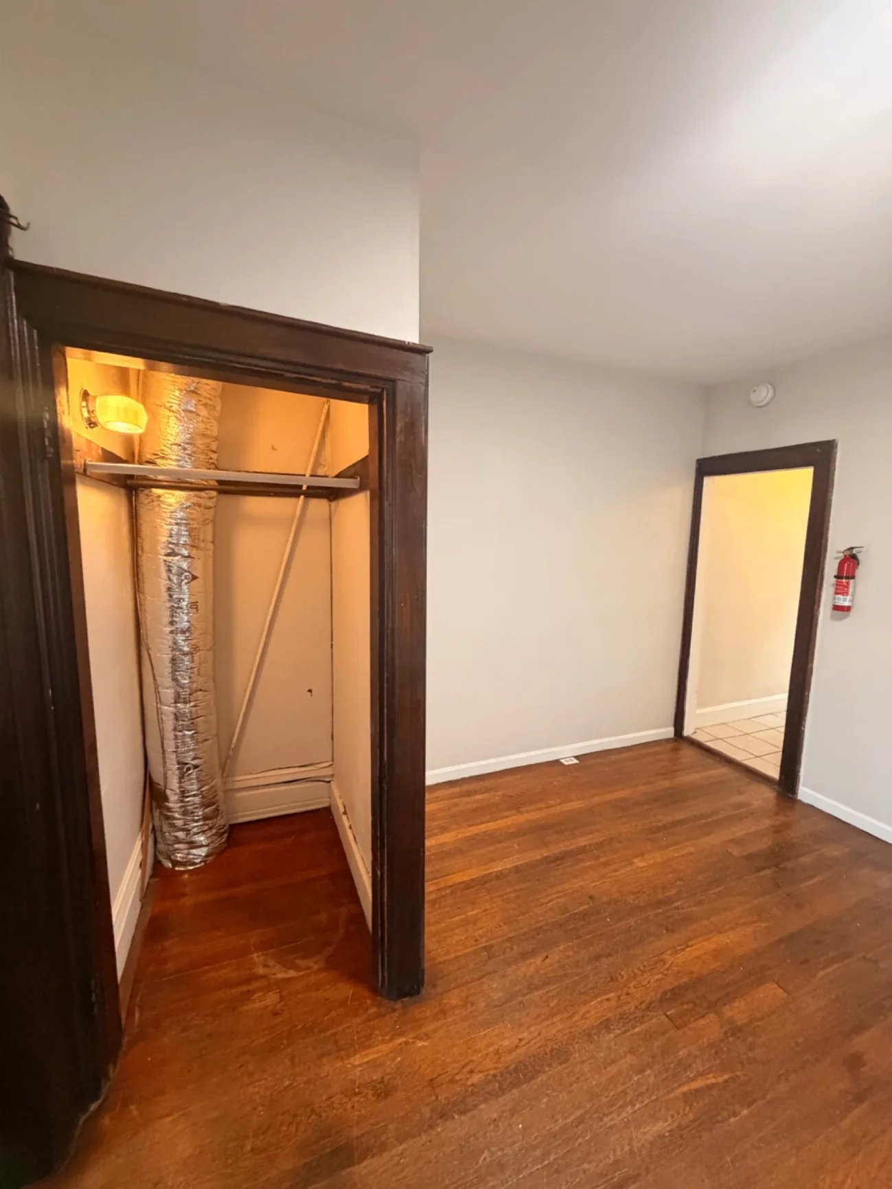 1816 Summit St. utility closet and hallway with hardwood floors